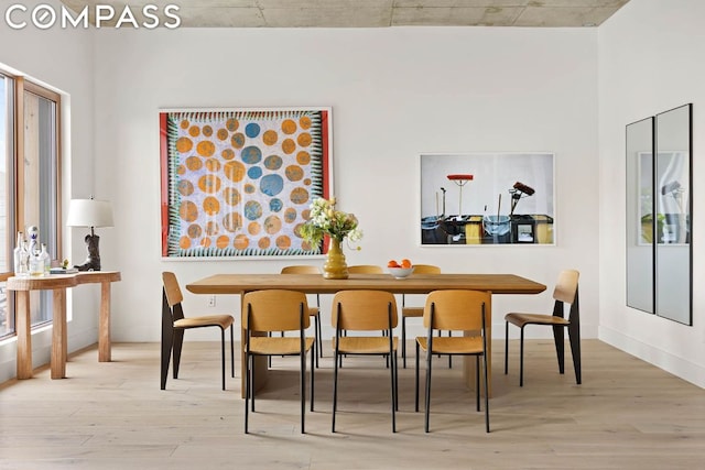 dining space with light hardwood / wood-style flooring