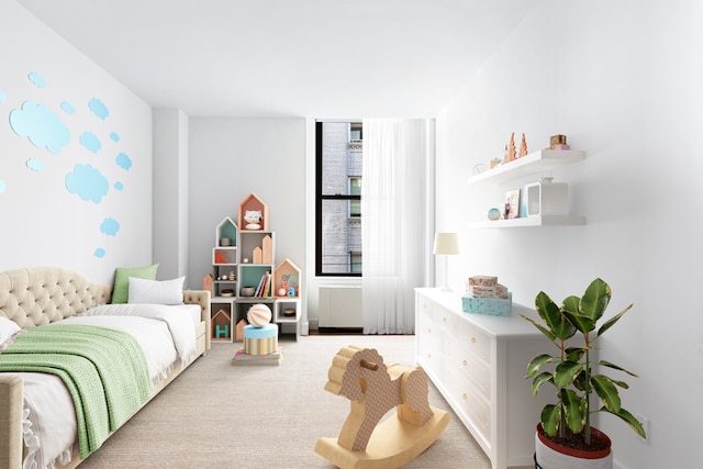 bedroom featuring light colored carpet