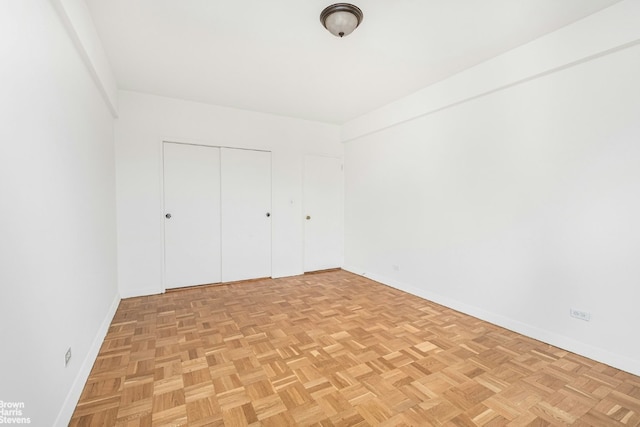 unfurnished bedroom featuring light parquet floors