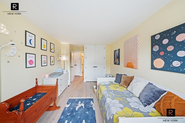 bedroom with light wood finished floors