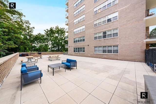 view of patio featuring fence