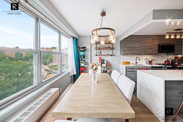 555 Kappock St Unit 8-H, New York City, NY 10463 - dining room with a chandelier