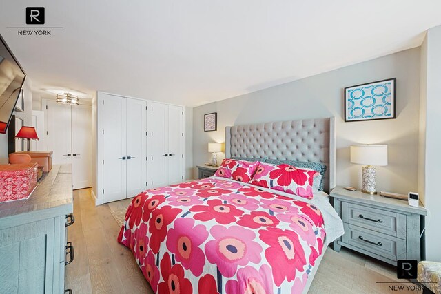 bedroom featuring light wood-style flooring