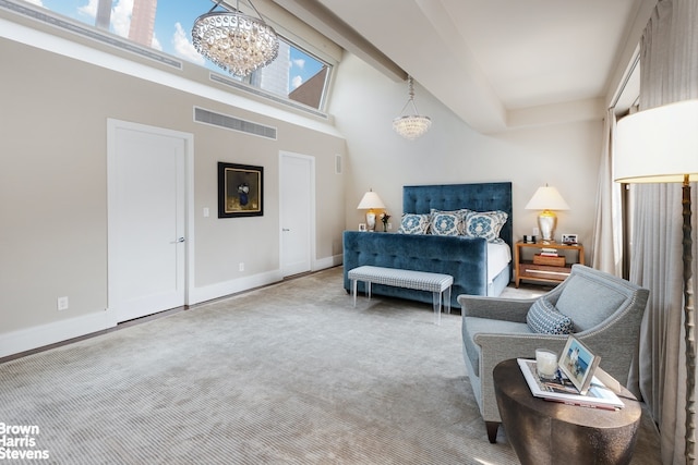 carpeted bedroom with multiple windows and a chandelier