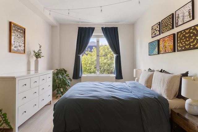 bedroom with light wood-type flooring