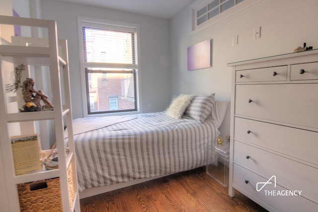 bedroom with wood finished floors