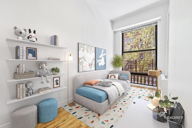 bedroom featuring wood finished floors