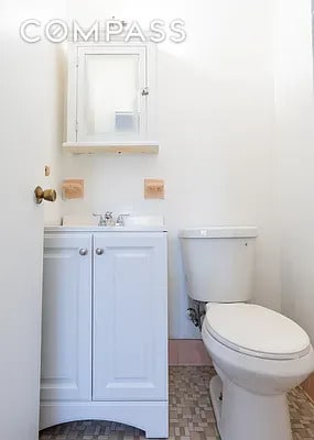 half bath with vanity and toilet