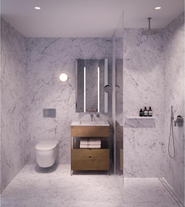 bathroom featuring walk in shower, vanity, toilet, and tile walls