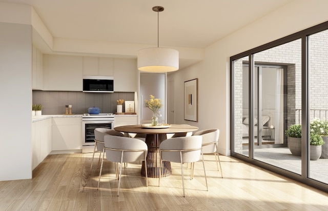 dining space with light wood-type flooring