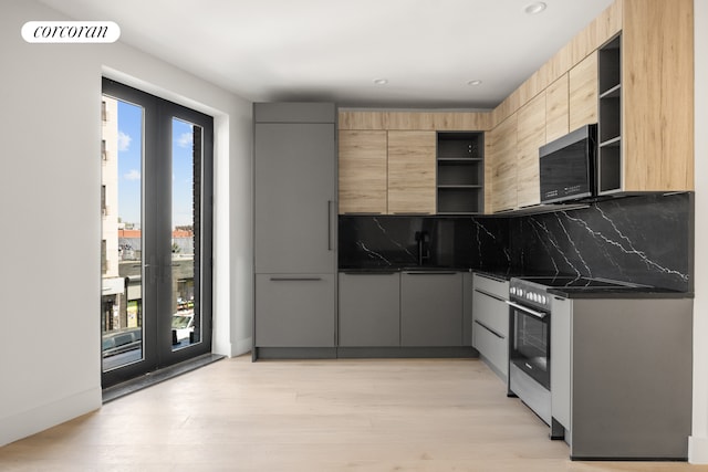 kitchen with visible vents, decorative backsplash, stainless steel range with electric cooktop, modern cabinets, and open shelves