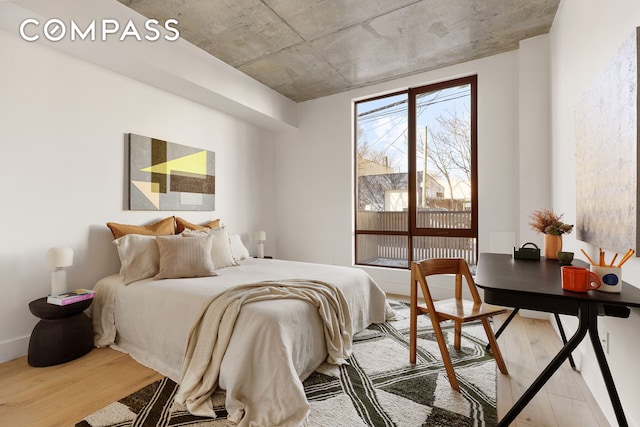 bedroom featuring wood finished floors