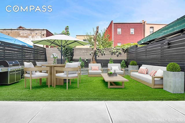 view of yard with fence and outdoor lounge area