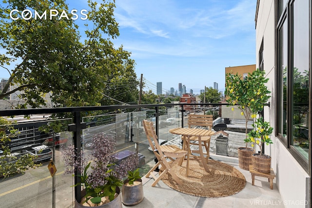 balcony featuring a city view