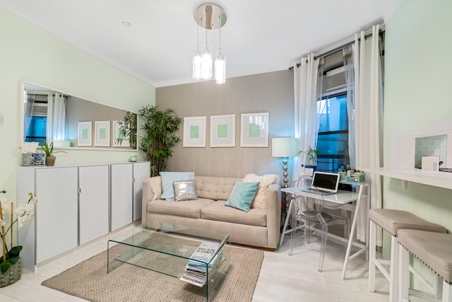 living area featuring ornamental molding and light wood-style floors