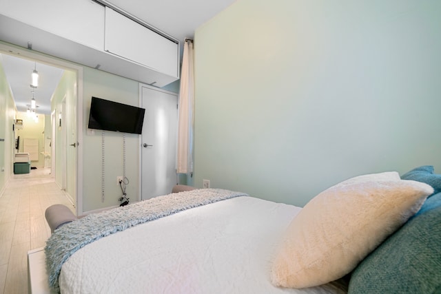 bedroom featuring wood finished floors