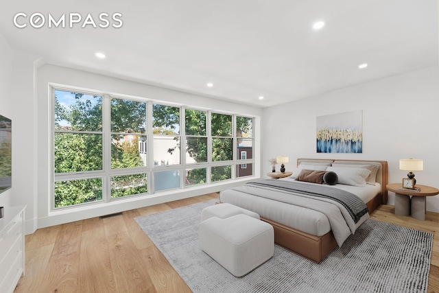 bedroom featuring visible vents, recessed lighting, and light wood-type flooring