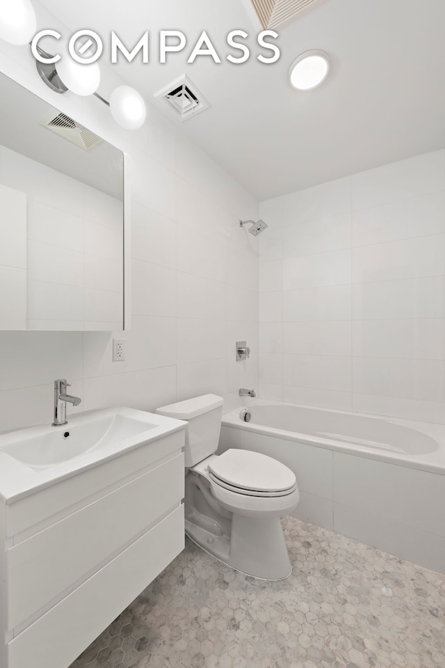 full bath featuring tub / shower combination, visible vents, toilet, and vanity