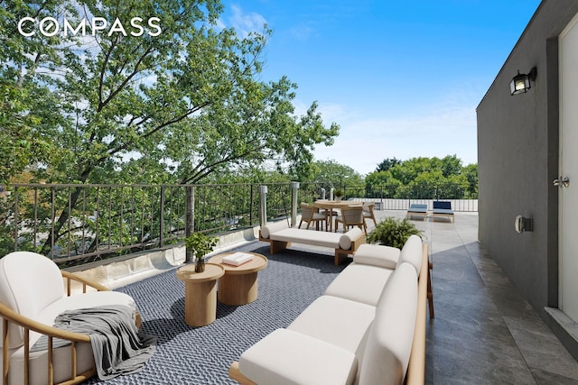 balcony featuring outdoor lounge area and outdoor dining space