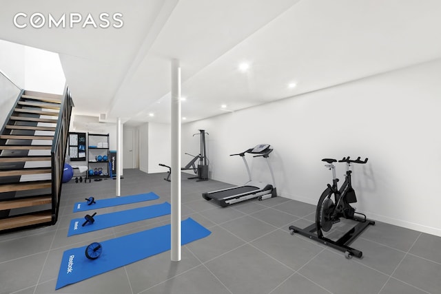 workout area featuring recessed lighting and baseboards