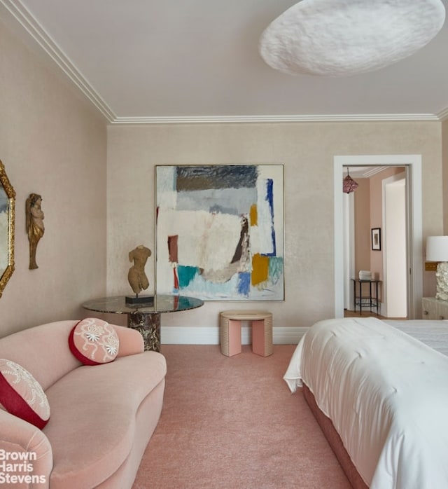 bedroom with ornamental molding and carpet floors