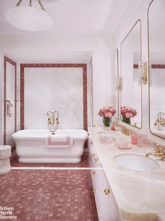 bathroom featuring vanity and a tub