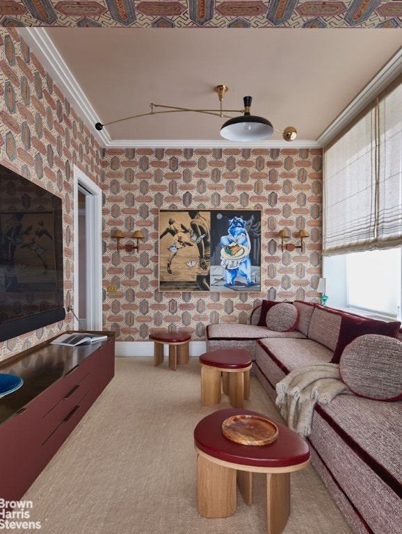 living room with crown molding and carpet floors