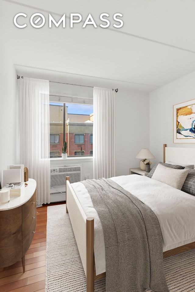 bedroom with light wood finished floors