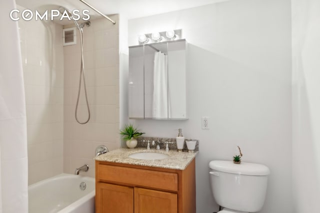 full bathroom featuring toilet, shower / tub combo, vanity, and visible vents