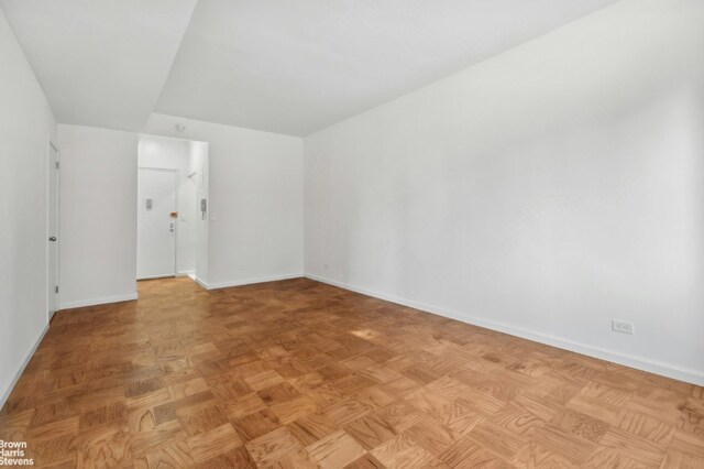 walk in closet featuring parquet floors