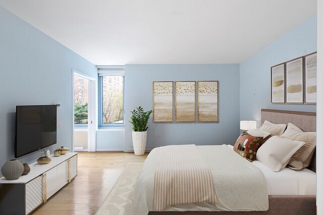 425 W 53rd St Unit 301, New York City, NY 10019 - bedroom featuring light wood finished floors
