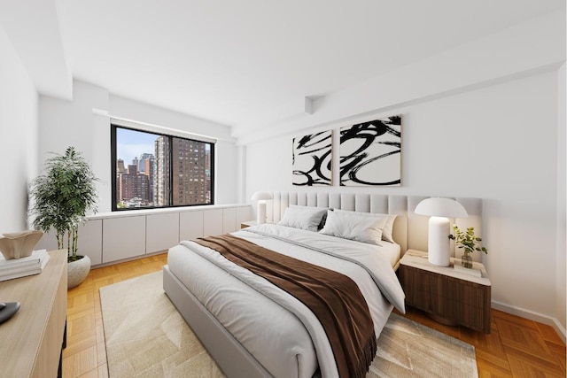 bedroom featuring light parquet flooring