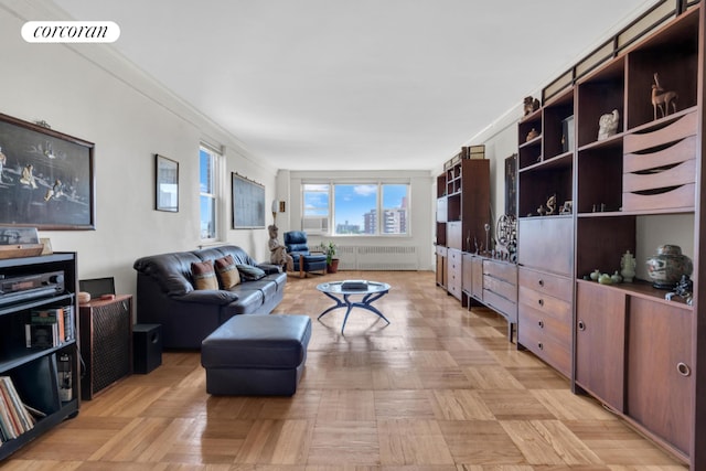 living room with light parquet floors, radiator heating unit, and ornamental molding