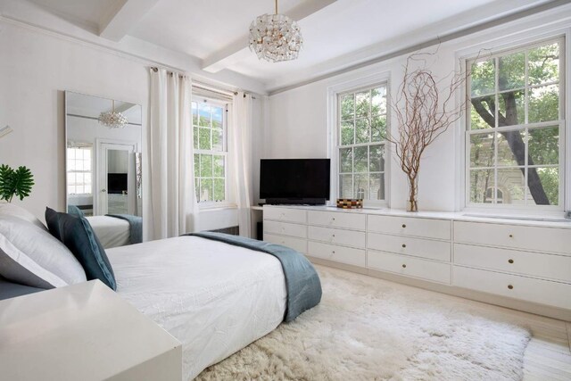 sitting room with crown molding and light parquet flooring