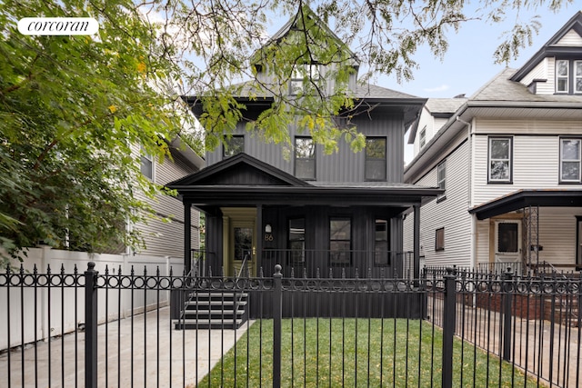 view of front facade featuring a porch and a front lawn