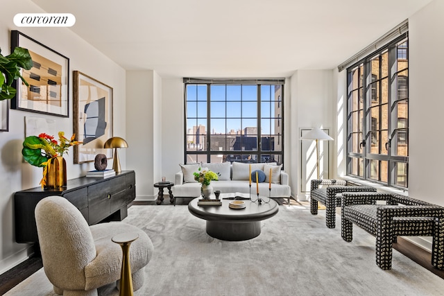 sitting room featuring expansive windows and visible vents