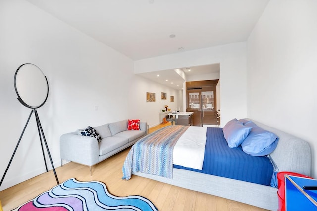 bedroom with wood-type flooring