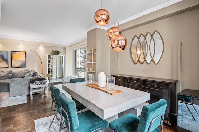 dining room featuring dark parquet flooring and ornamental molding