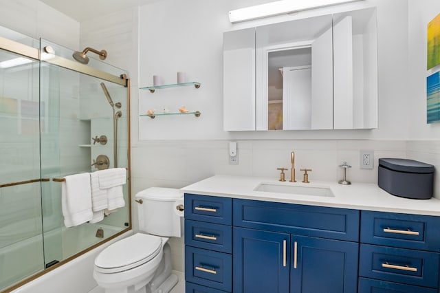 full bathroom with toilet, vanity, tile walls, tasteful backsplash, and enclosed tub / shower combo