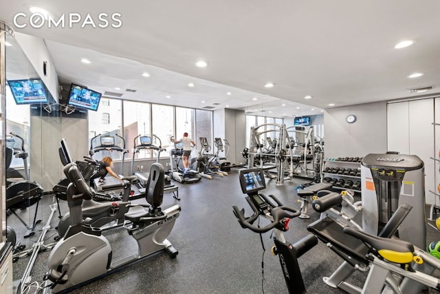 exercise room with visible vents and recessed lighting