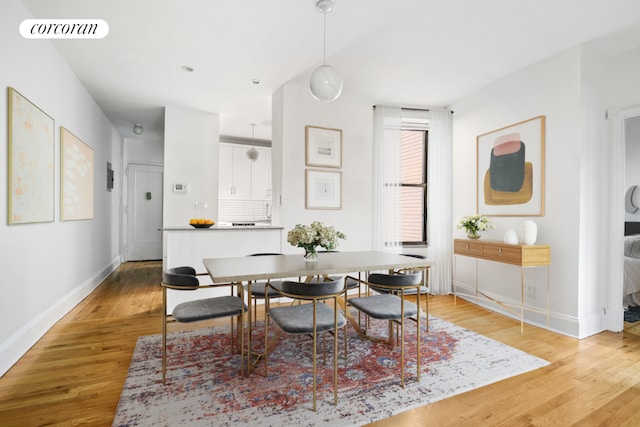 dining space featuring light hardwood / wood-style floors