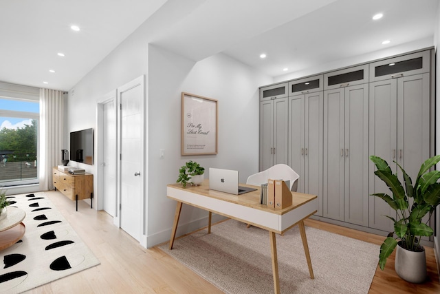 office with baseboards, light wood-style flooring, and recessed lighting