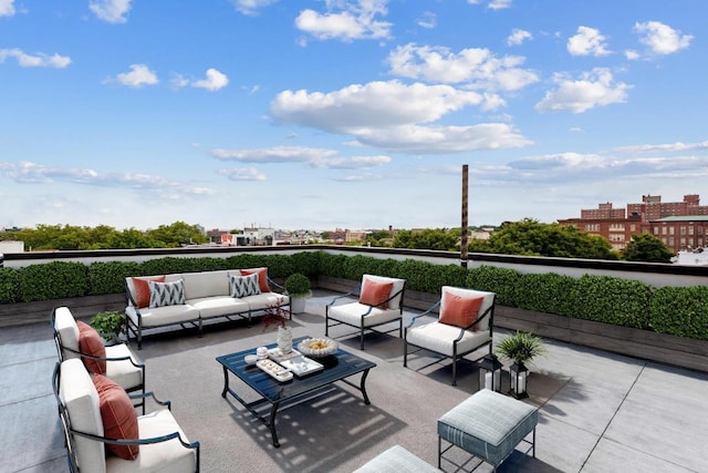 view of patio / terrace with a view of city and an outdoor living space