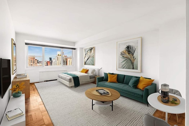 bedroom featuring a city view and radiator heating unit