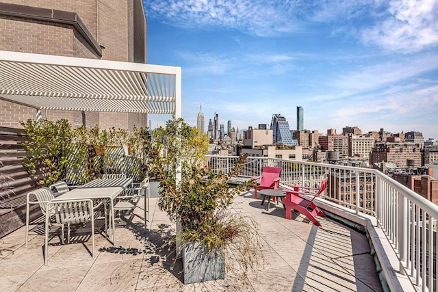 balcony featuring a skyline view