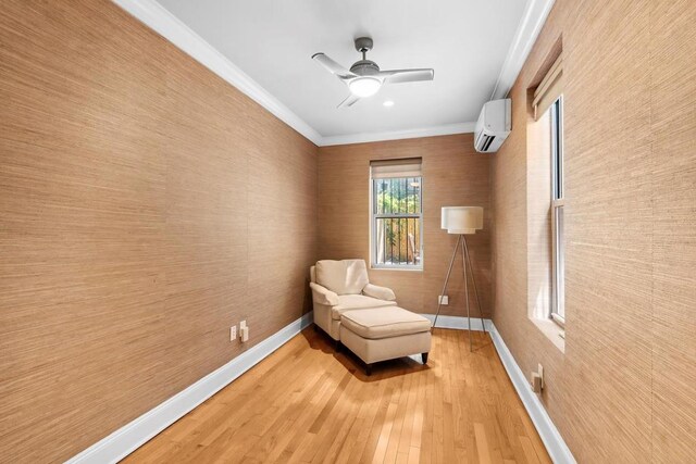 bedroom featuring crown molding, wood-type flooring, and a large fireplace