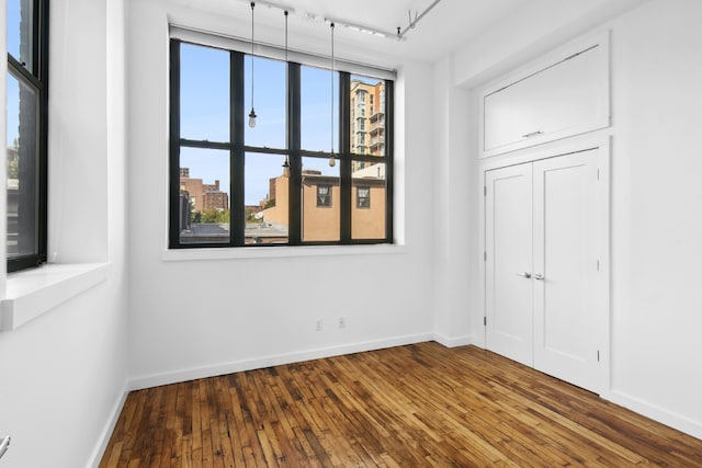 spare room featuring dark hardwood / wood-style floors