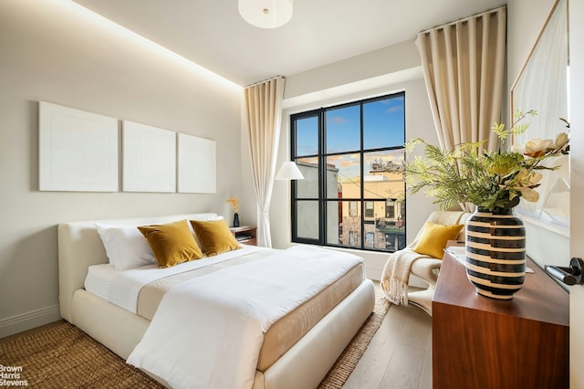 bedroom featuring wood-type flooring