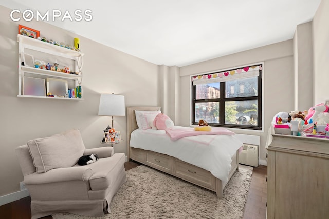 bedroom with baseboards and light wood-style floors