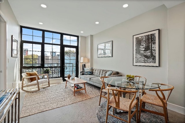 living room with floor to ceiling windows